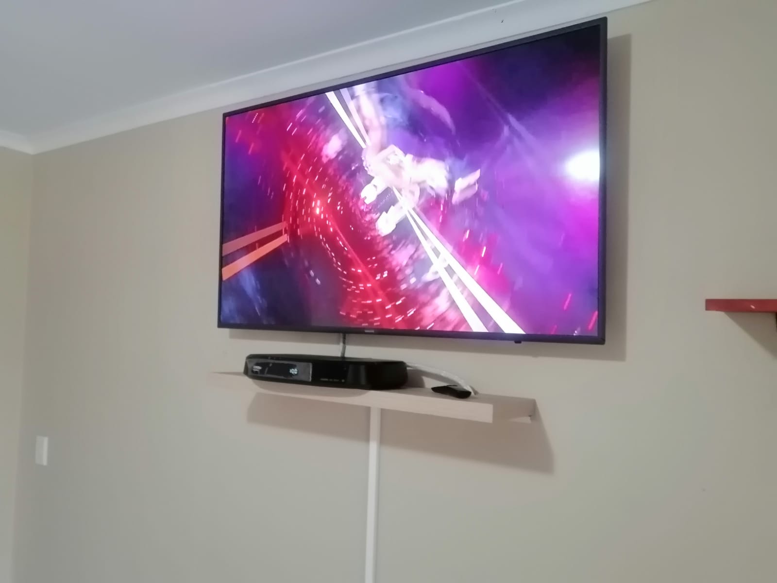 TV wall mounting with DStv setup